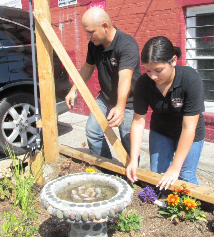 Miguel and Kathy Hernandez working the garden.jpg